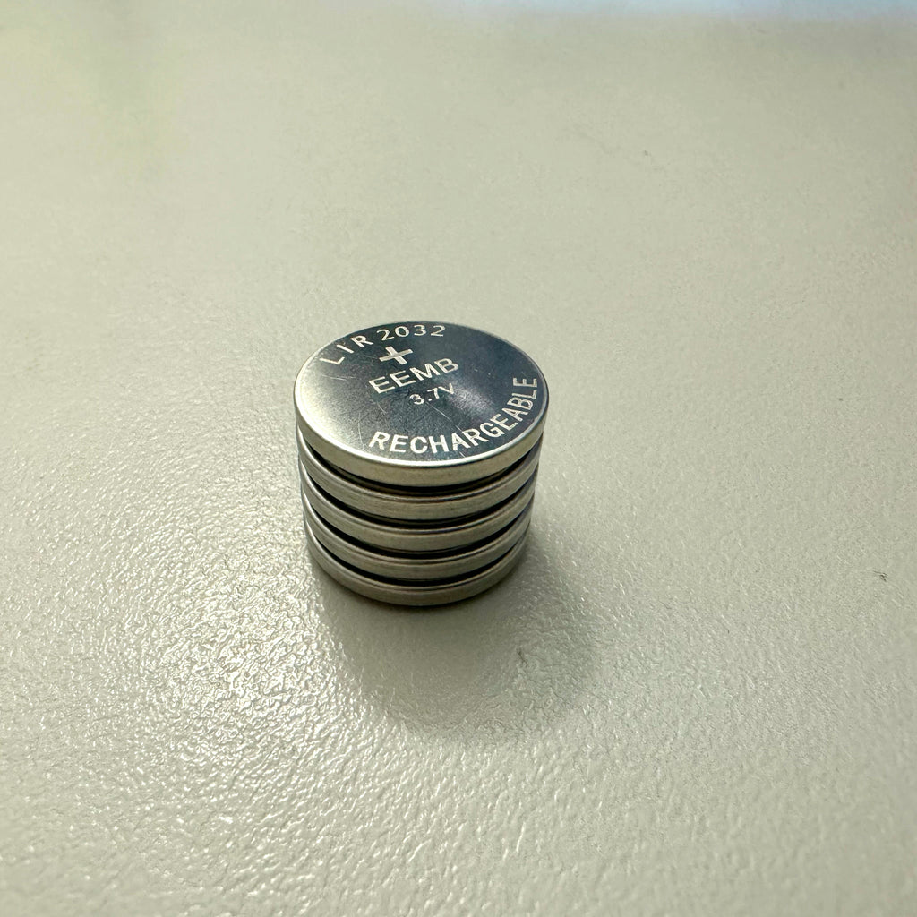 Five TagCharge LIR2032 rechargeable coin cell batteries stacked showing 3.2mm thickness
