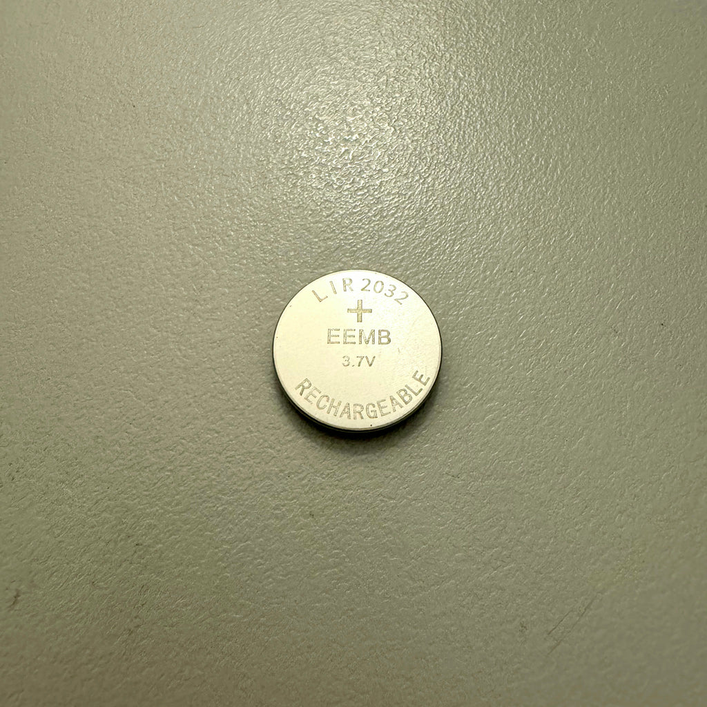 Single LIR2032 rechargeable coin cell battery face up showing markings